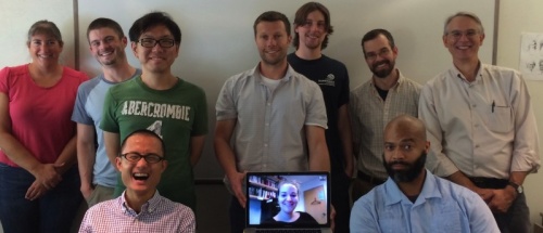 Front row, from left: Jun Otsuka, Sarah Roe (on screen), Michael Hunter. Back row, from left: Roberta L. Millstein, Rick Morris, I-Sen Chen, Tyrus Fisher, Josef Kay, Shawn A. Miller, James R. Griesemer